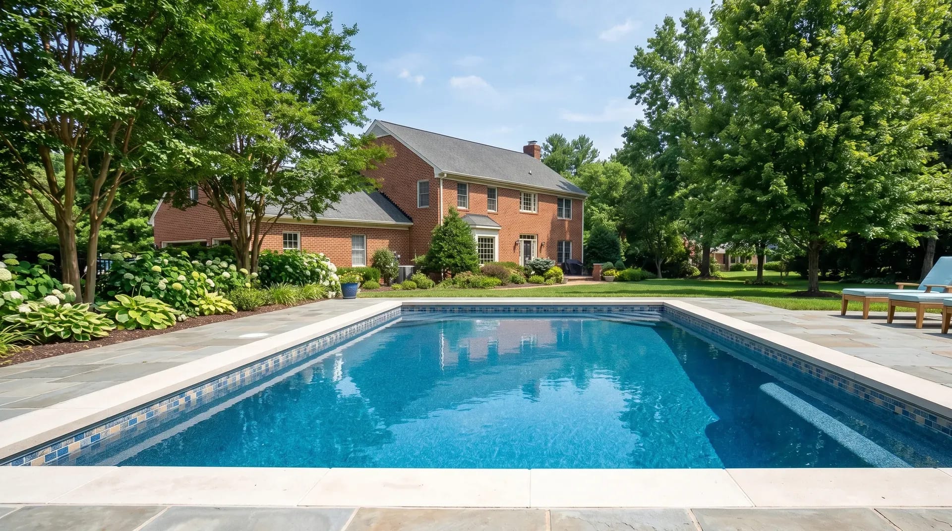 Freshly resurfaced inground pool with new plaster interior and waterline tile in a Virginia backyard