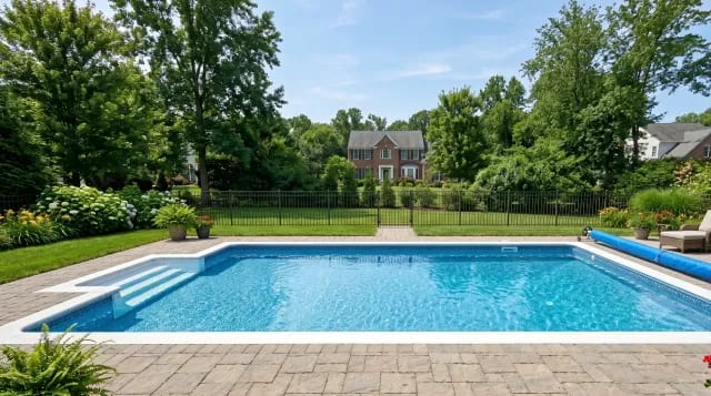 Rectangular inground vinyl-liner pool with patterned liner and paver deck